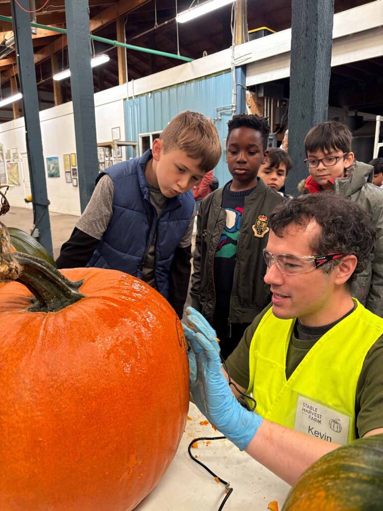 children learning about pumpkin carving